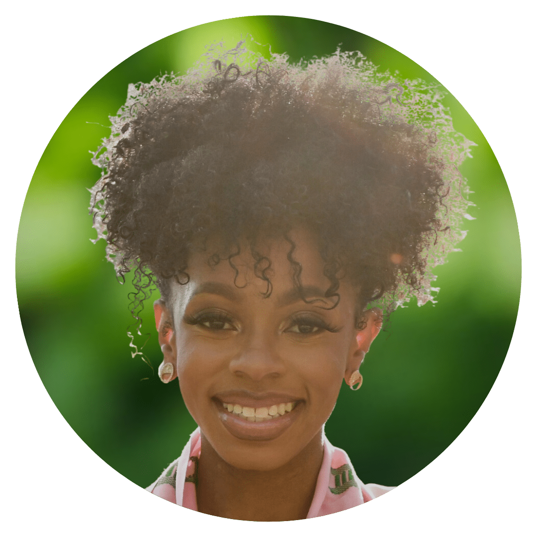 Circle cutout of De'Ja W.'s professional headshot, with a background of leaves