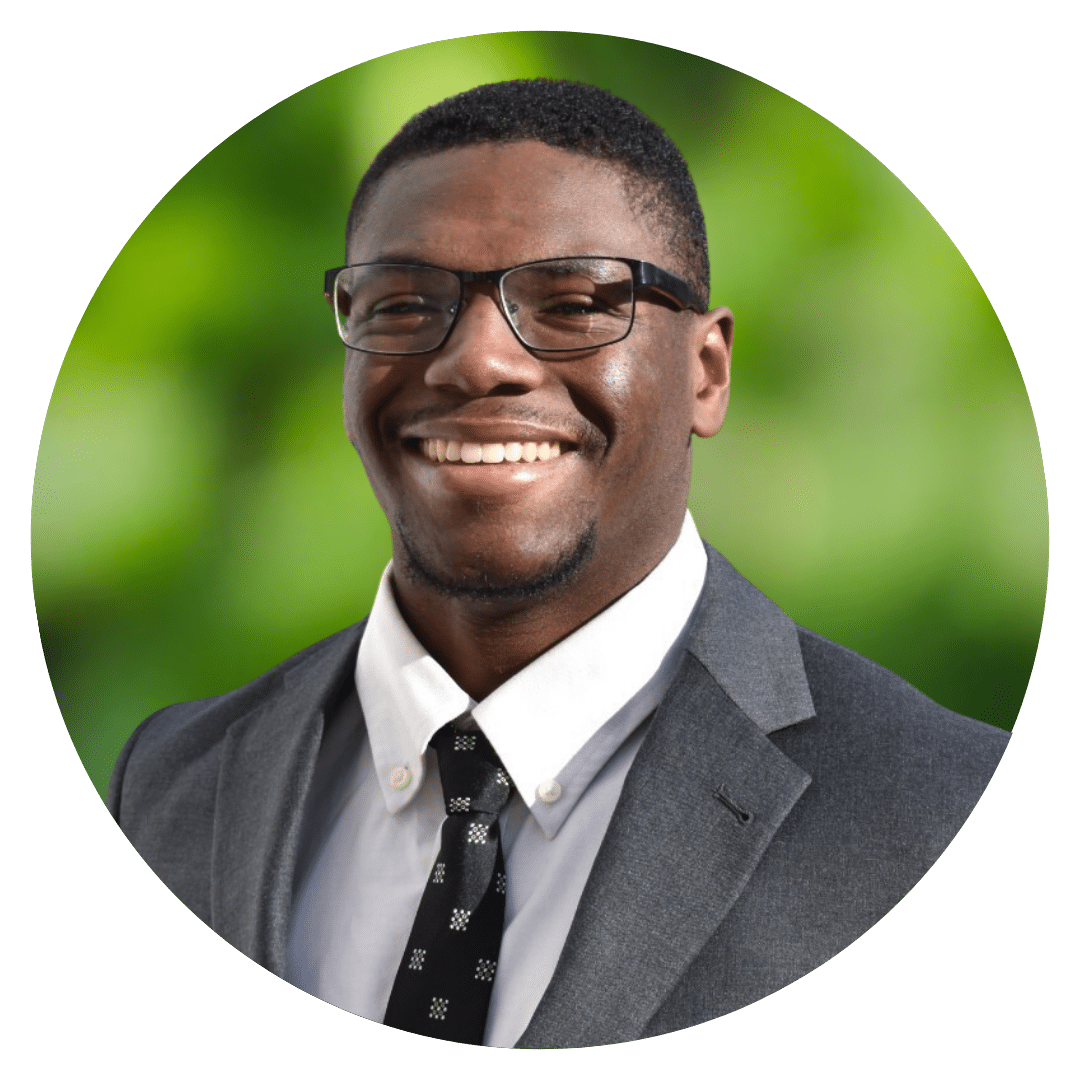 Circle cutout of Jimmie J.'s professional headshot, with a background of leaves