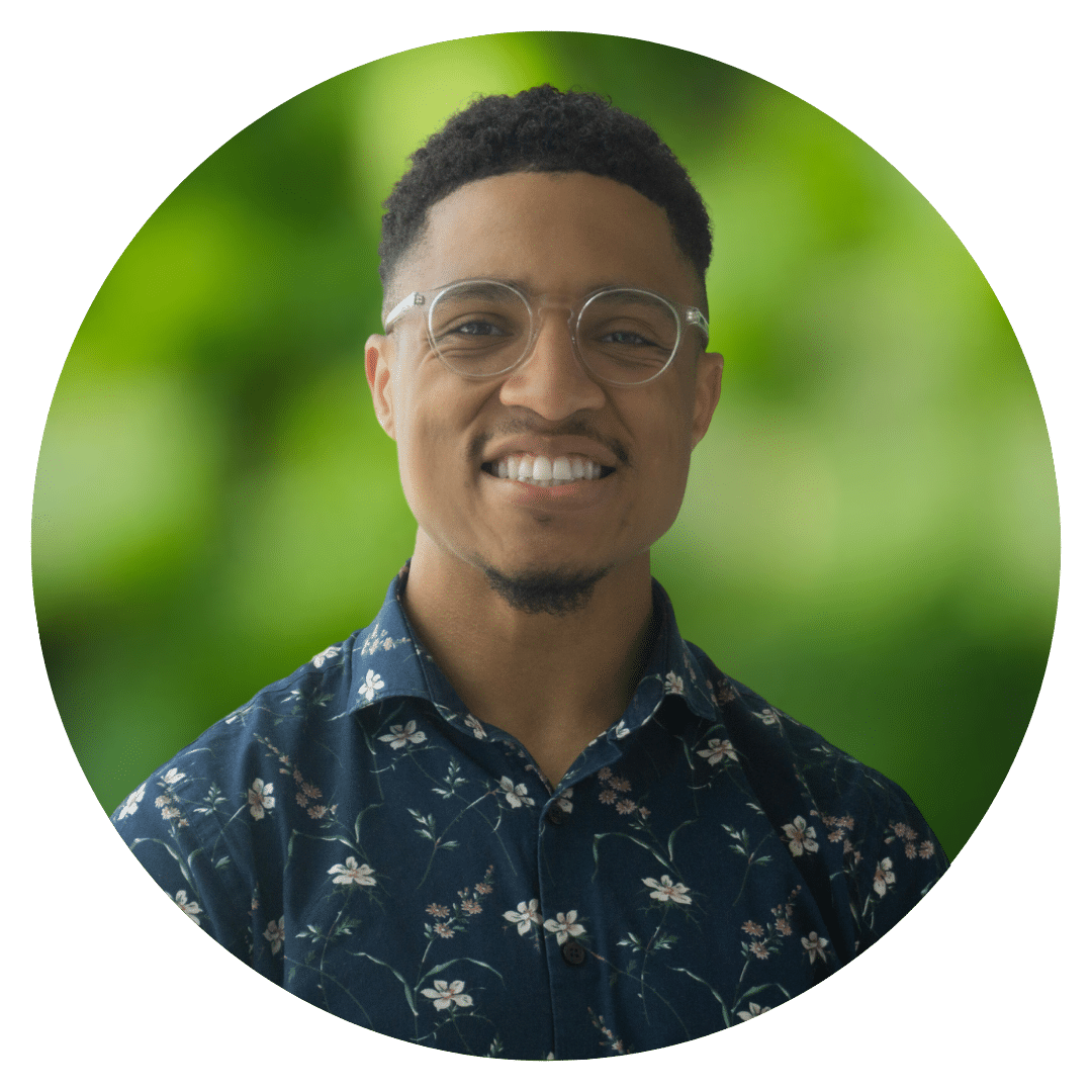 Circle cutout of Nicholas H.'s professional headshot, with a background of leaves