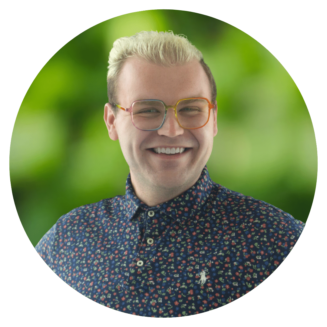 Circle cutout of Peter E.'s professional headshot, with a background of leaves