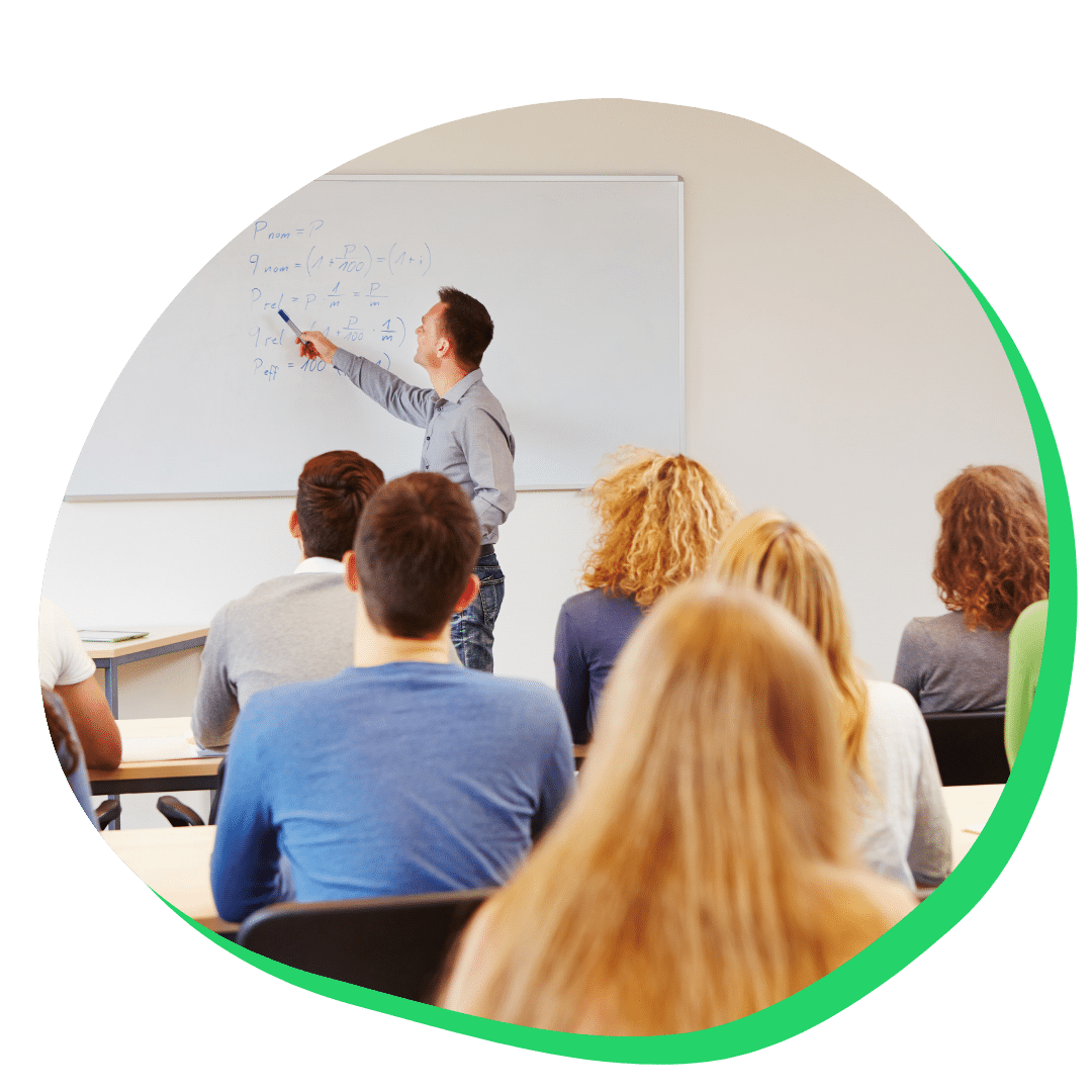 Students listening to professor in a college classroom