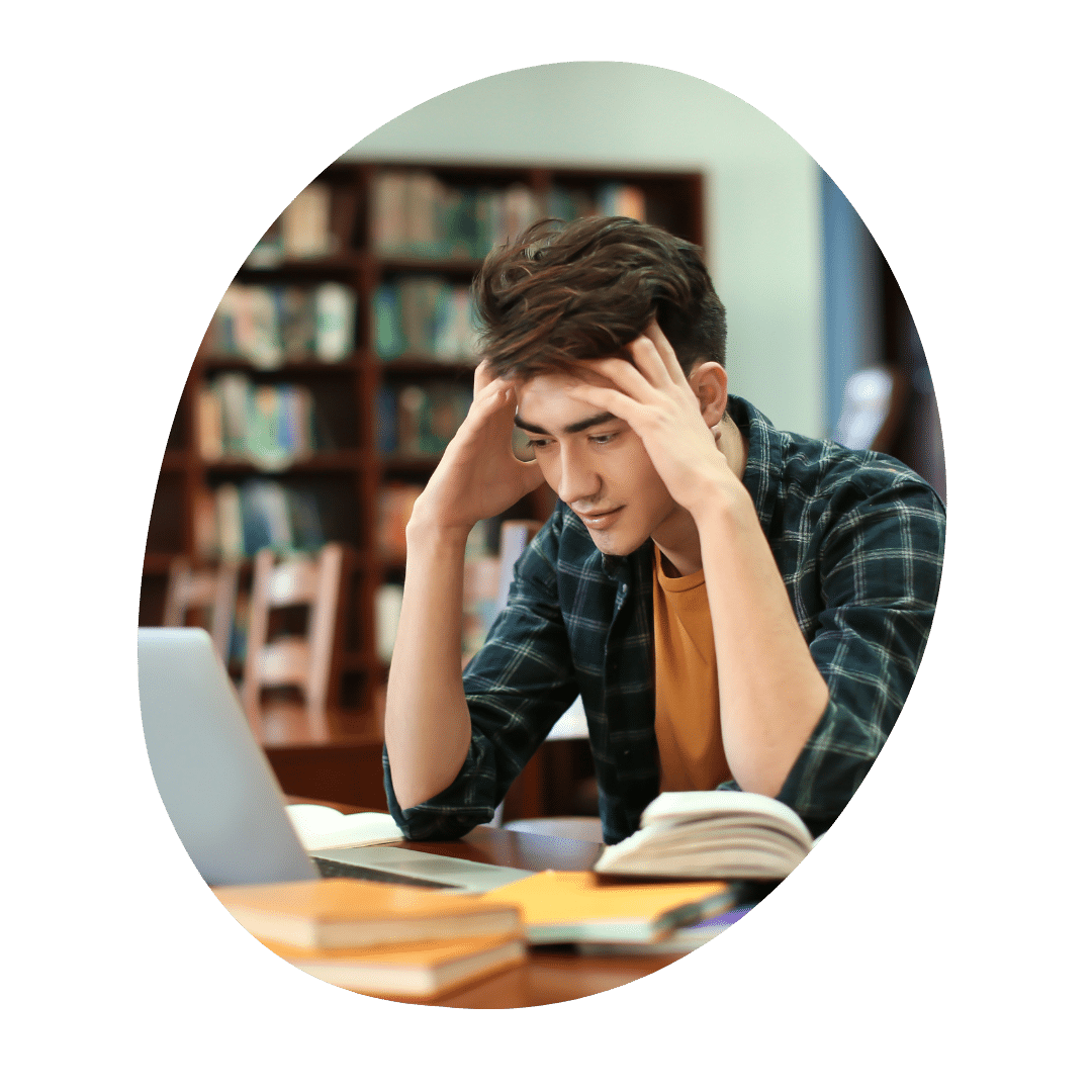 student focussing on writing his college essay