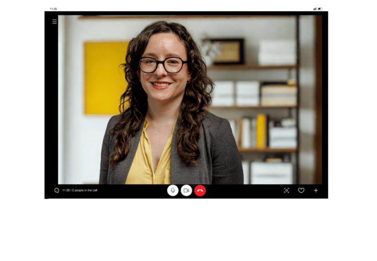 Katie on a Zoom call inside a laptop graphic