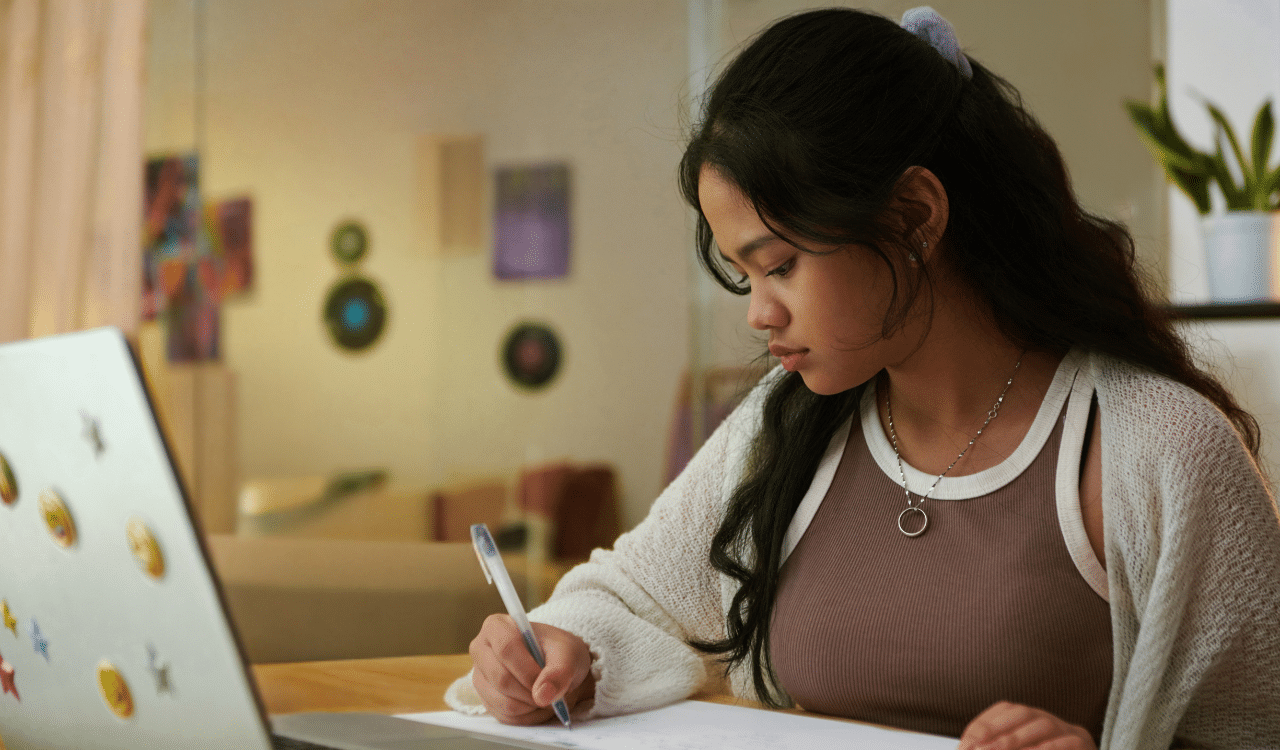 Common App essay prompts being reviewed by a student.