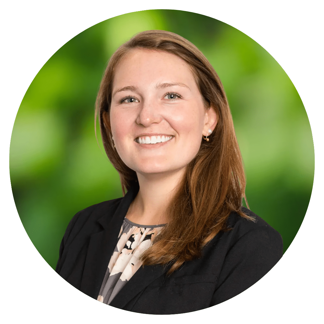 Circle cutout of Grace B.'s professional headshot, with a background of leaves