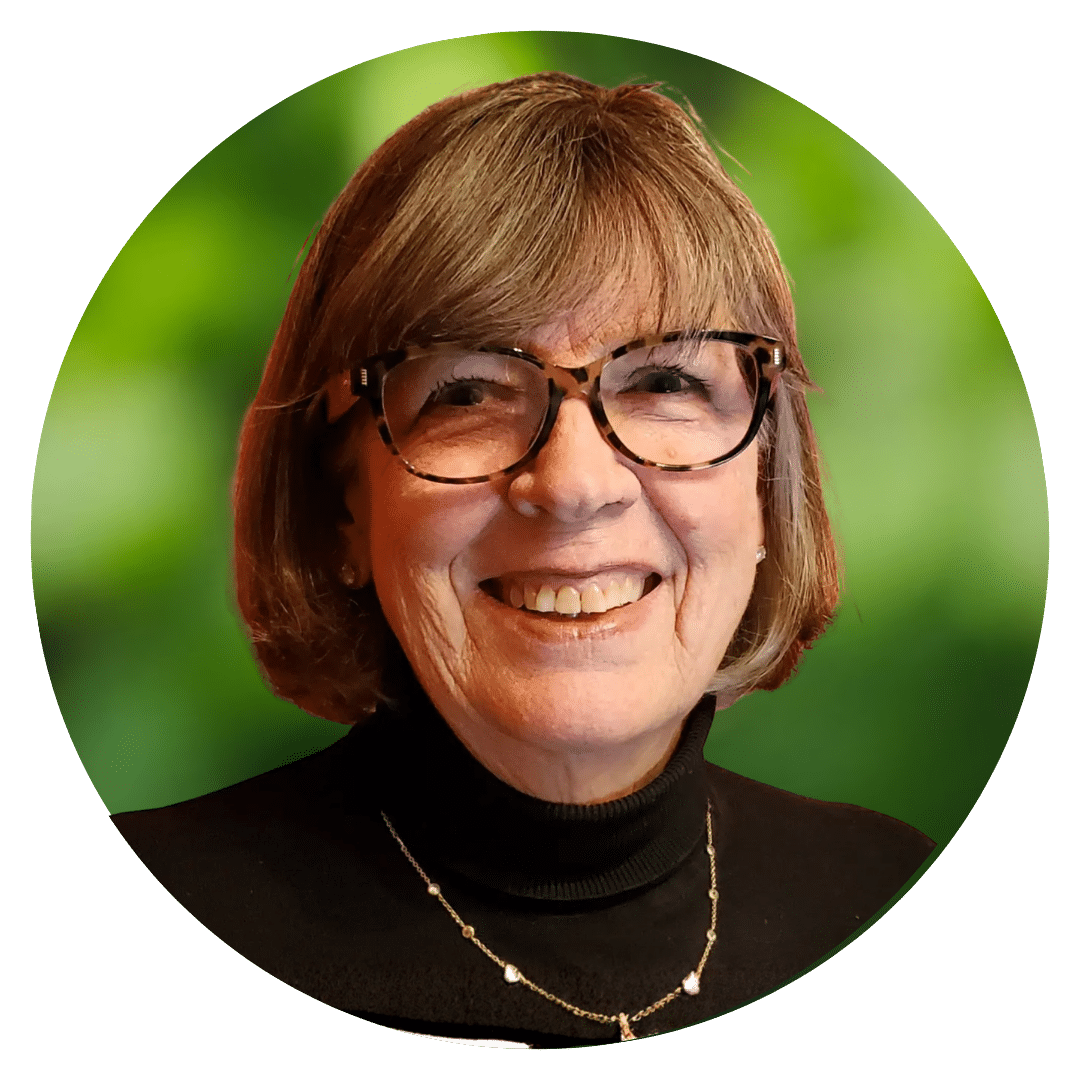 Circle cutout of Joyce S.'s professional headshot, with a background of leaves