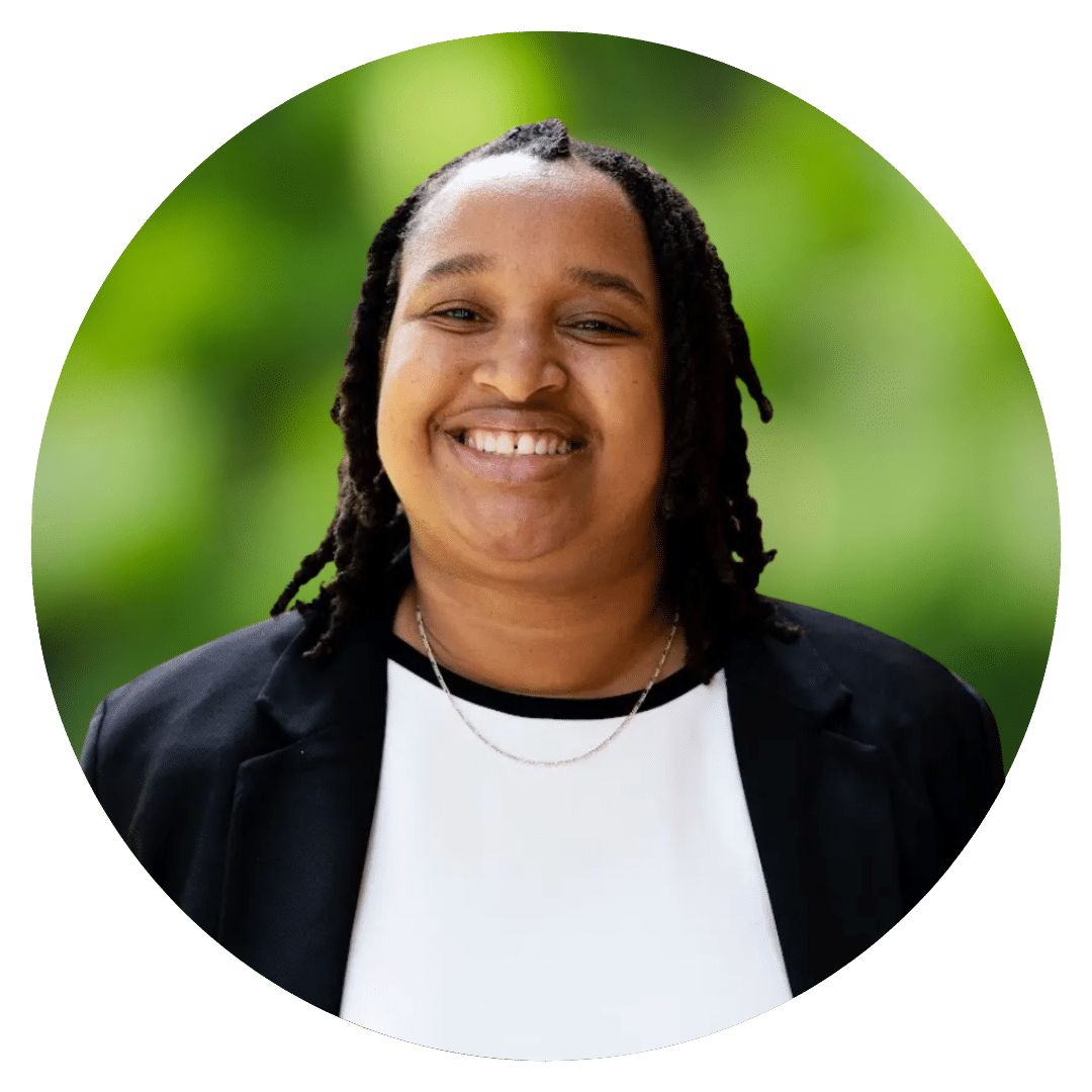 Circle cutout of Racquel B.'s professional headshot, with a background of leaves